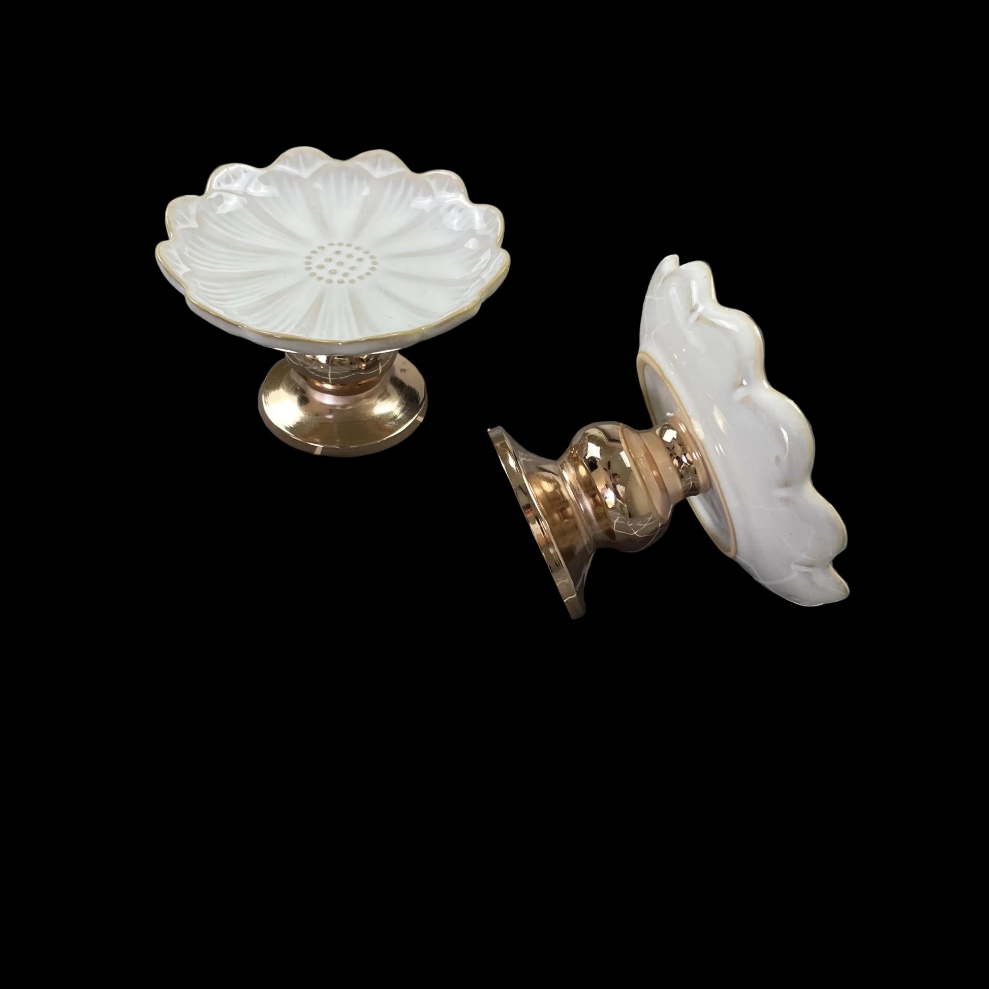 white ceramic flower-shaped dish stands with gold bases