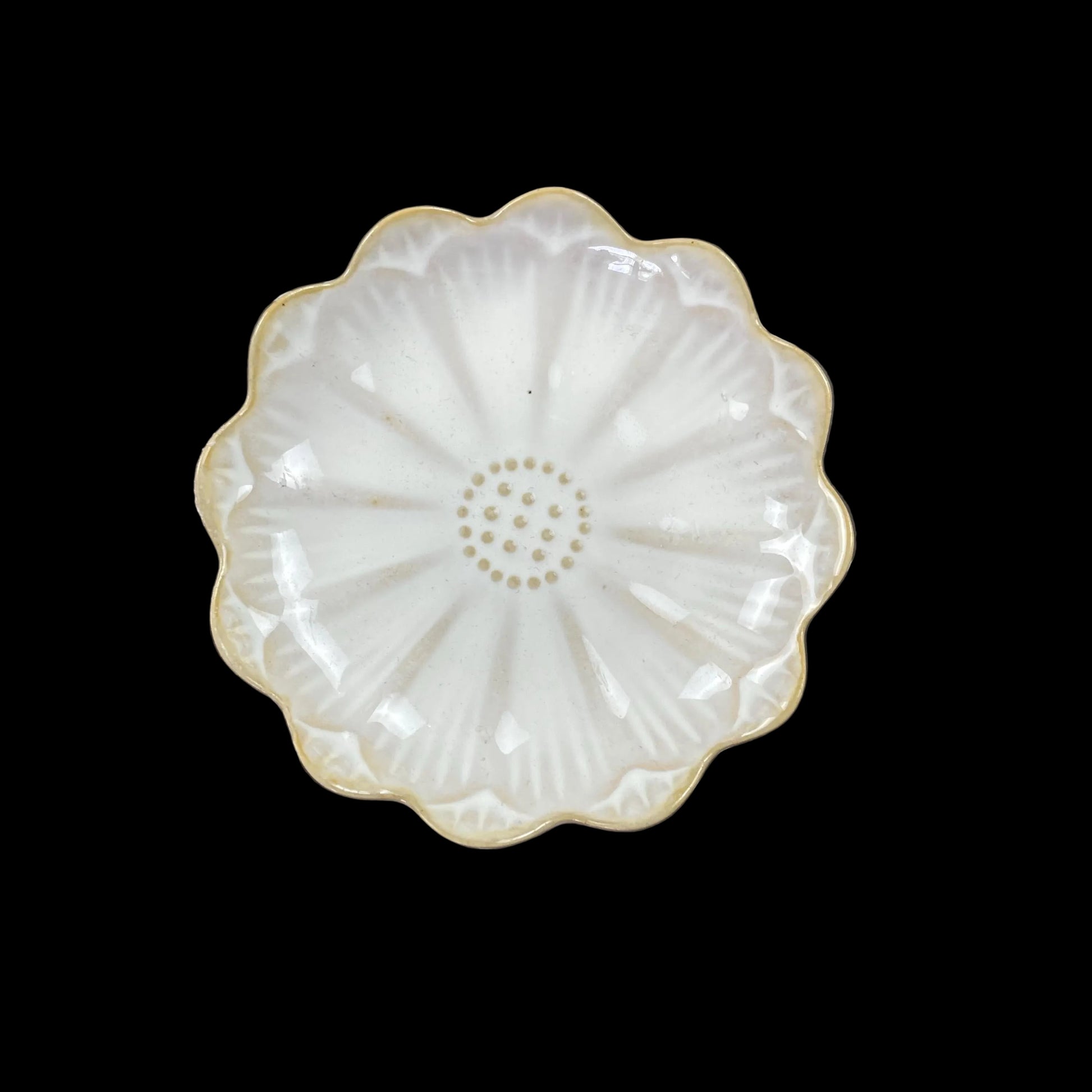 white ceramic flower-shaped dish stands with gold bases