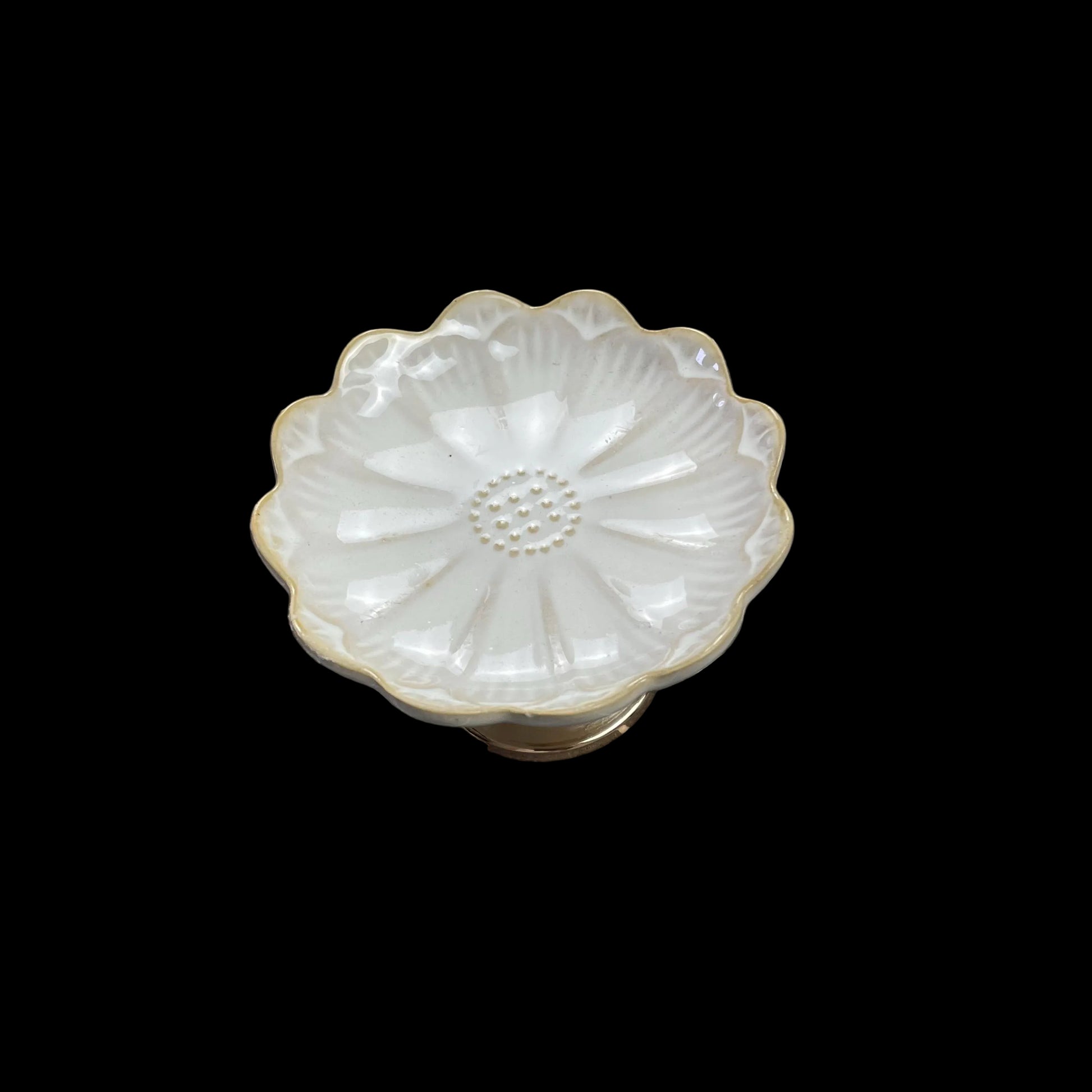 white ceramic flower-shaped dish stands with gold bases