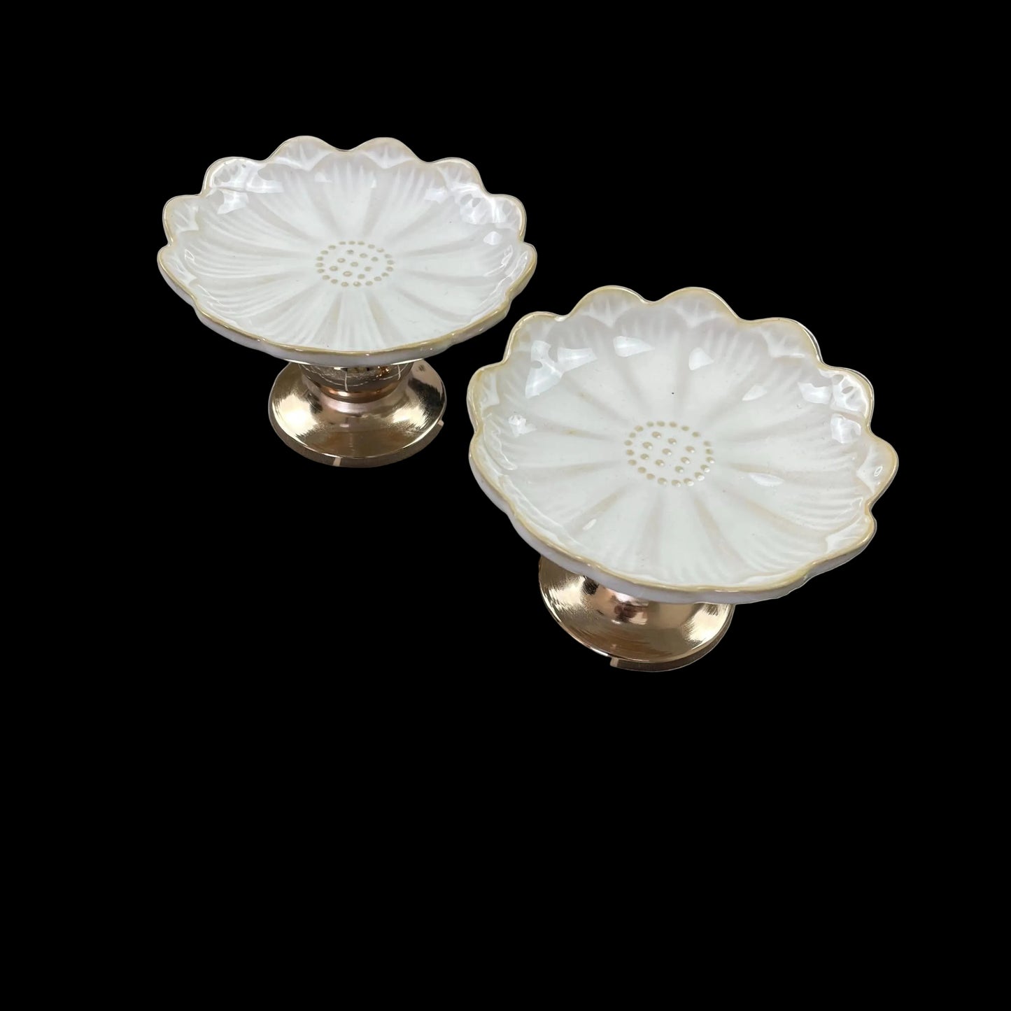 white ceramic flower-shaped dish stands with gold bases